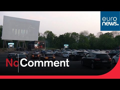 Let's party! People attend German concert drive-in cinema style